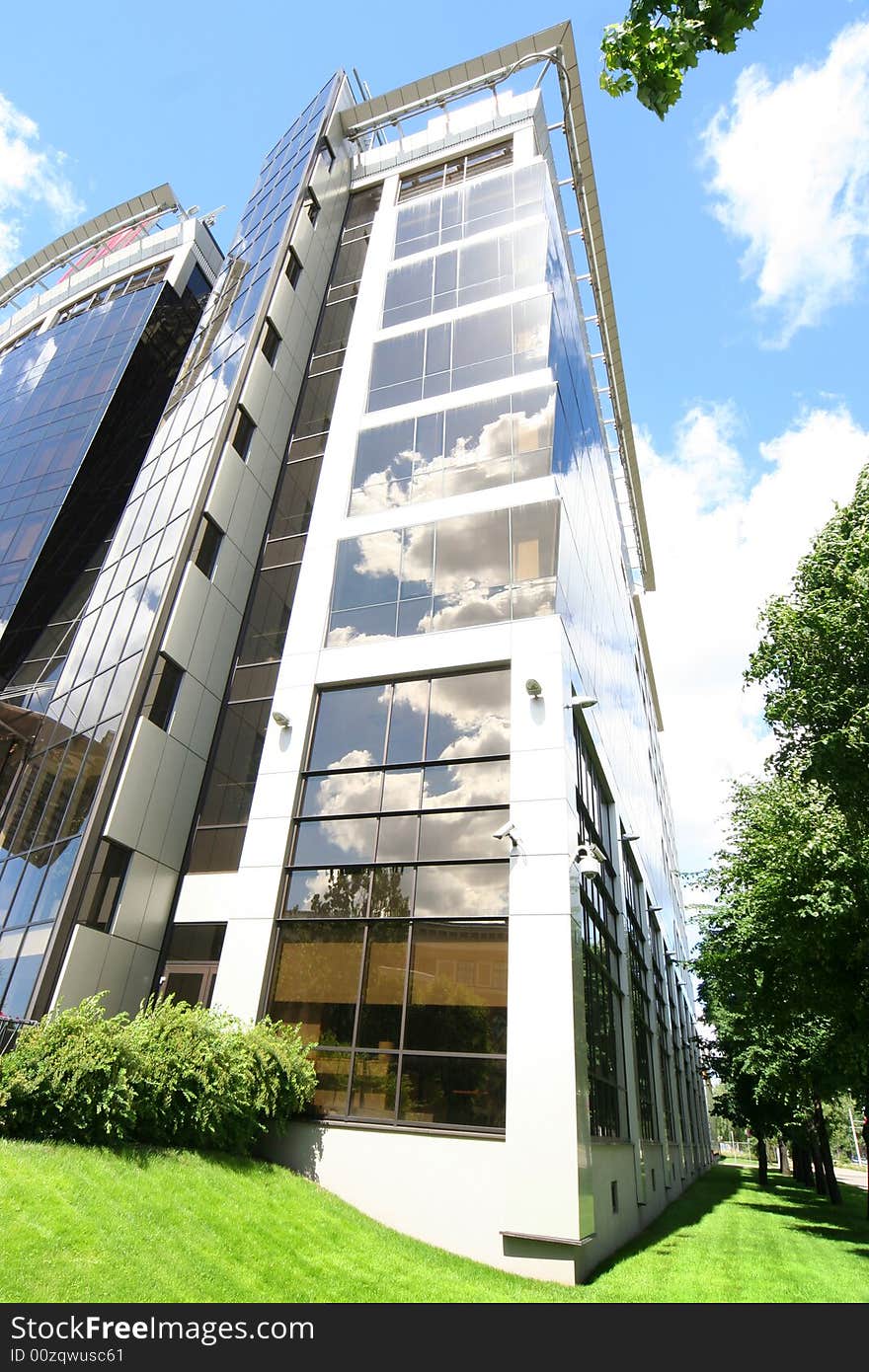 Modern mirrored building with blue sky. Modern mirrored building with blue sky