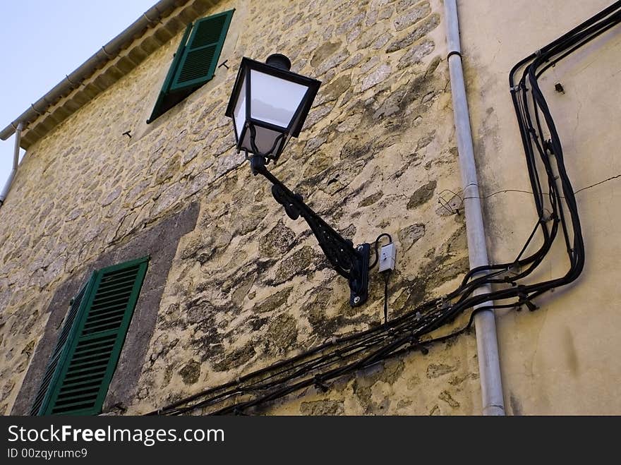 Stony wall with a lamp