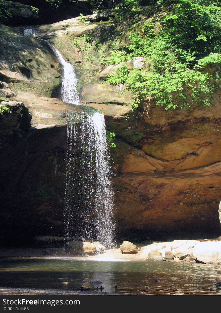 Small waterfall into pool of water