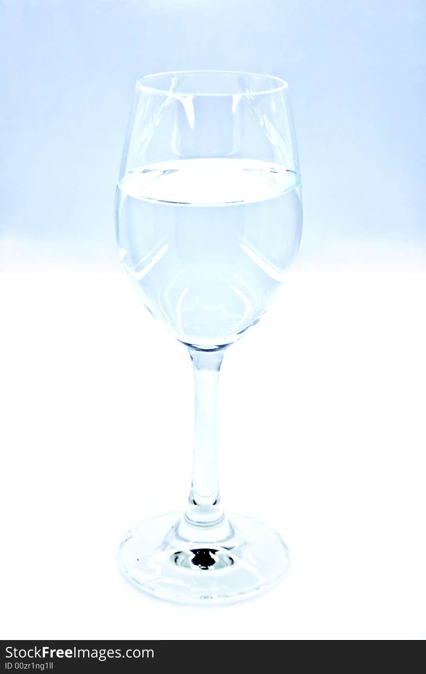 translucent glass of wine with the liquid on a white background. translucent glass of wine with the liquid on a white background