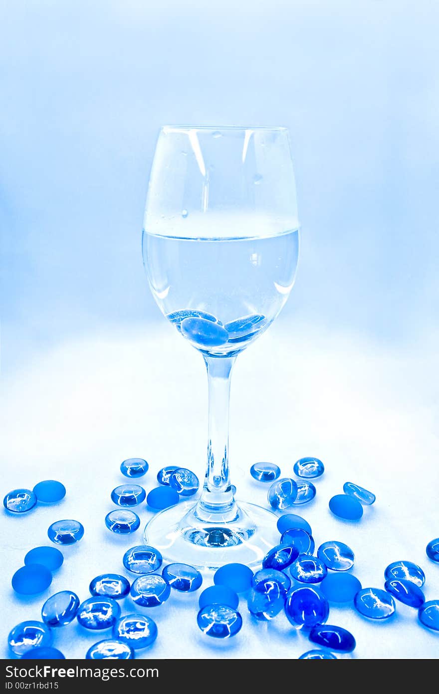 wine Goblet with blue glass balls. Abstraction. wine Goblet with blue glass balls. Abstraction