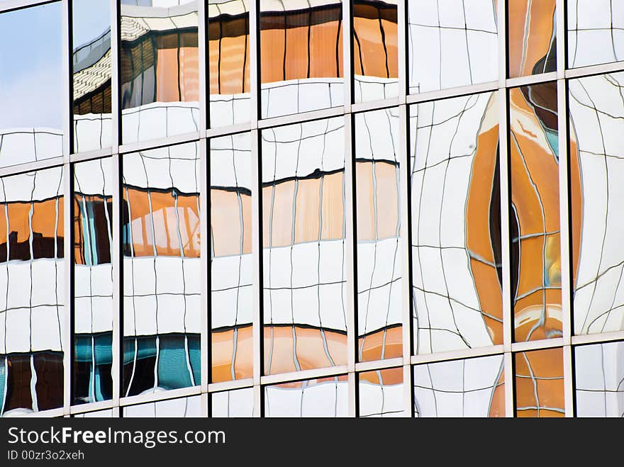 Modern corporate buildings reflected in office glass. Modern corporate buildings reflected in office glass.