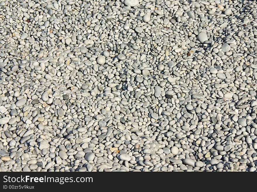 Close up photo of beach pebbles.