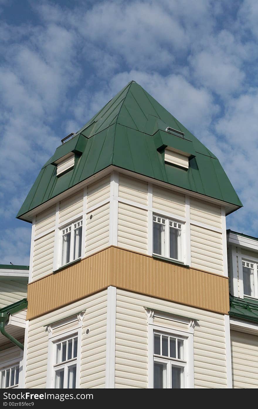 New wooden house with corner tower and