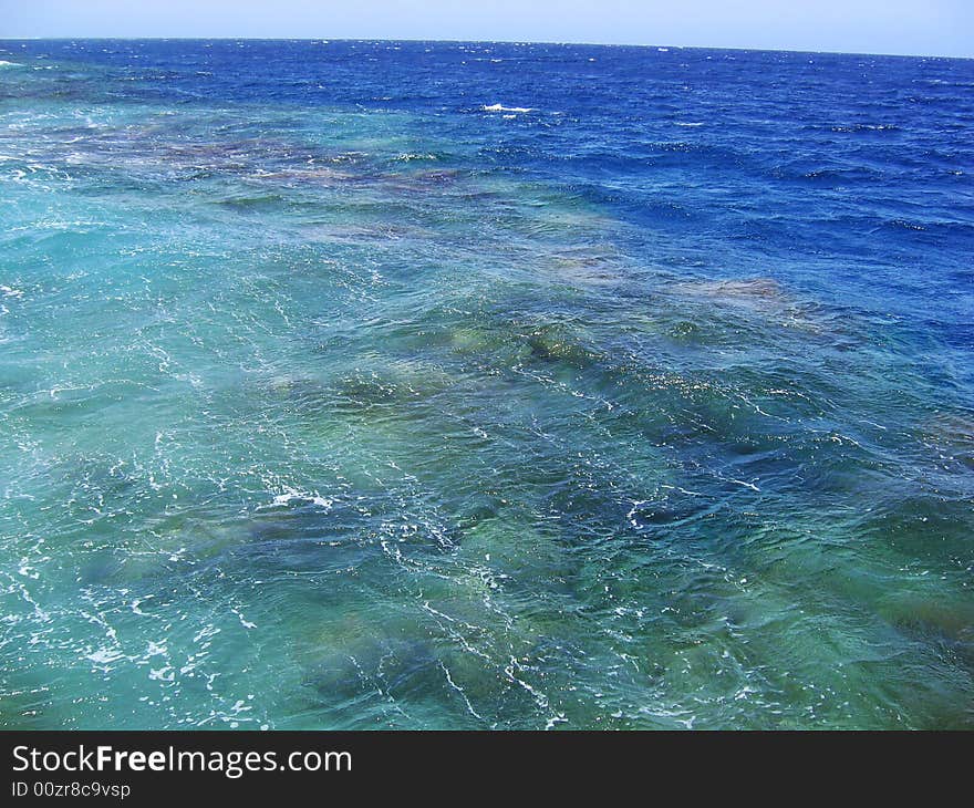 Small waves over the barrier coral reef. Small waves over the barrier coral reef