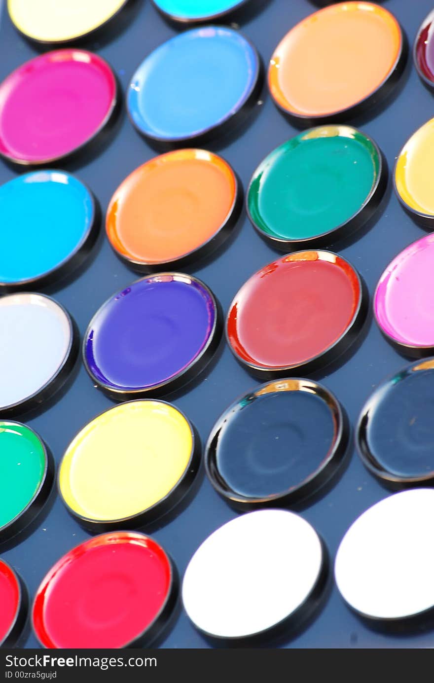 A close up shot of a paint palette. A close up shot of a paint palette