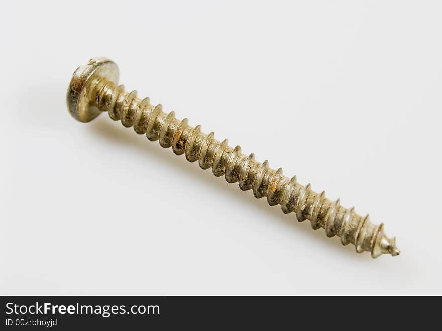 Rusted bolt against white background