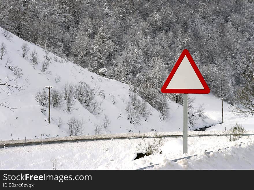 Danger empty traffic signal in snow covered road - winter landscape. Danger empty traffic signal in snow covered road - winter landscape