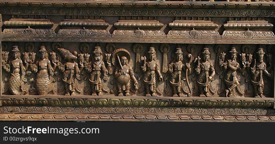 An artistic panel made out of wood with Indian Gods Godesses  seen at Handicraft fair at Ahmedabad. An artistic panel made out of wood with Indian Gods Godesses  seen at Handicraft fair at Ahmedabad.