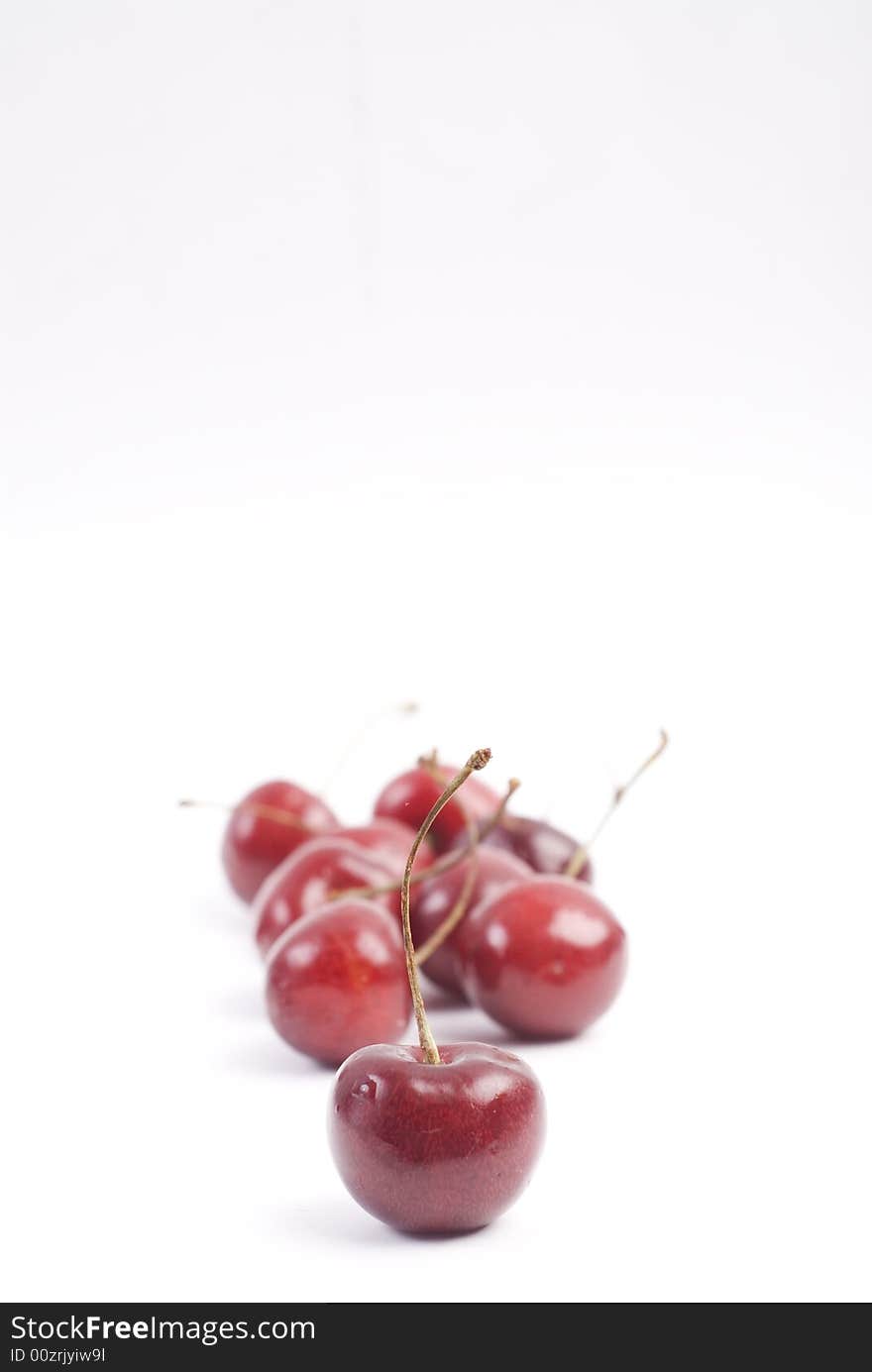 Sweet fresh red cherries isolated on white background. Sweet fresh red cherries isolated on white background