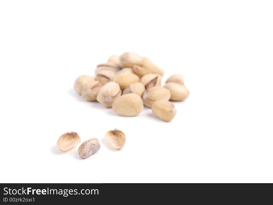 Solted pistachio nut at white isolated background