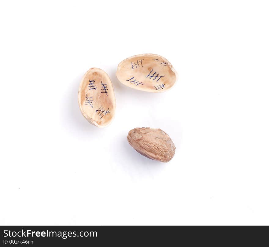 Solted pistachio nut at white isolated background