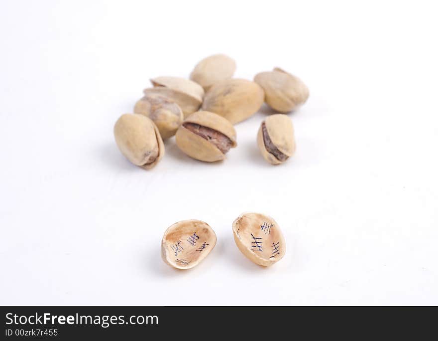 Solted pistachio nut at white isolated background