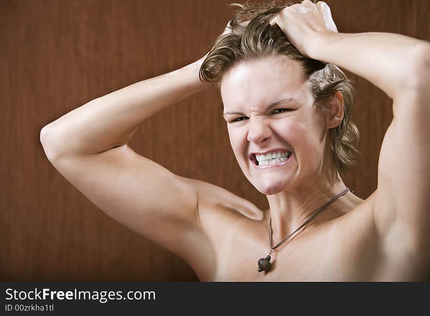 Portrait of a frustrated woman pulling her hair