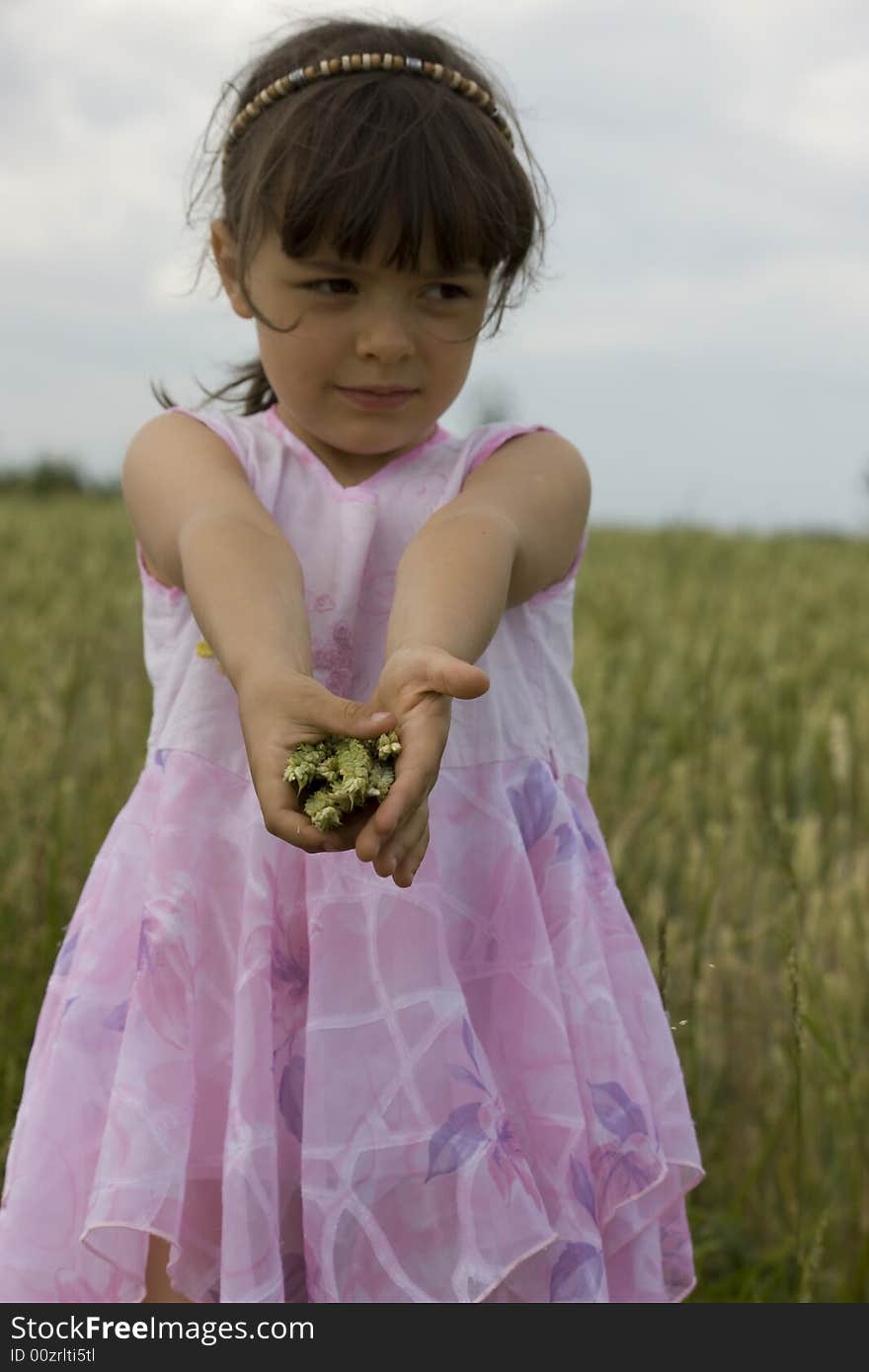 Baby Farmer Holding Grain