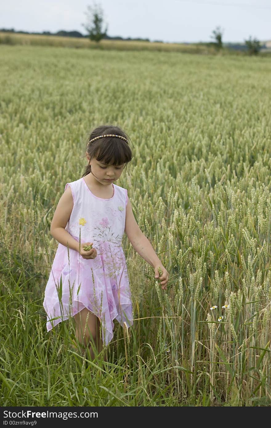 Baby farmer holding grain