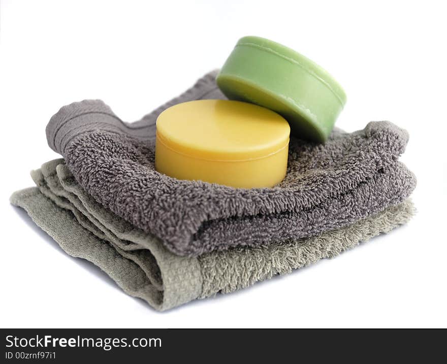 Two bars of soap with two grey flannels. Two bars of soap with two grey flannels.