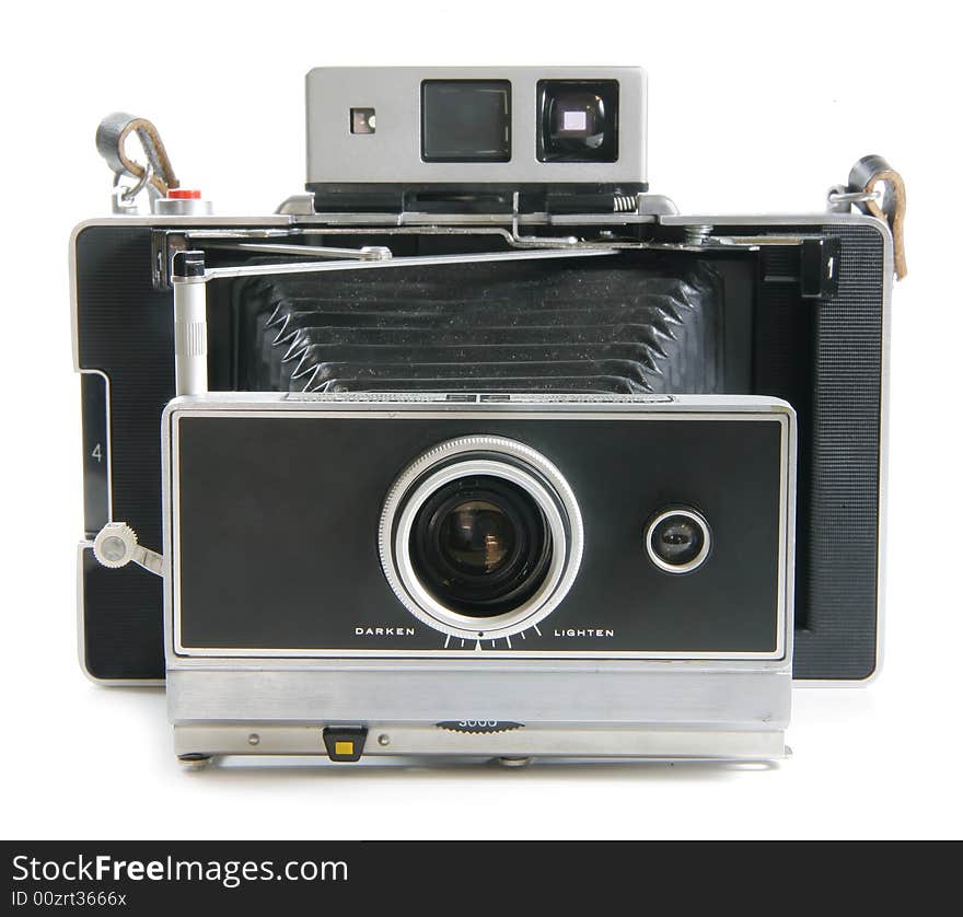 A old vintage land camera with bellows extended isolated on white