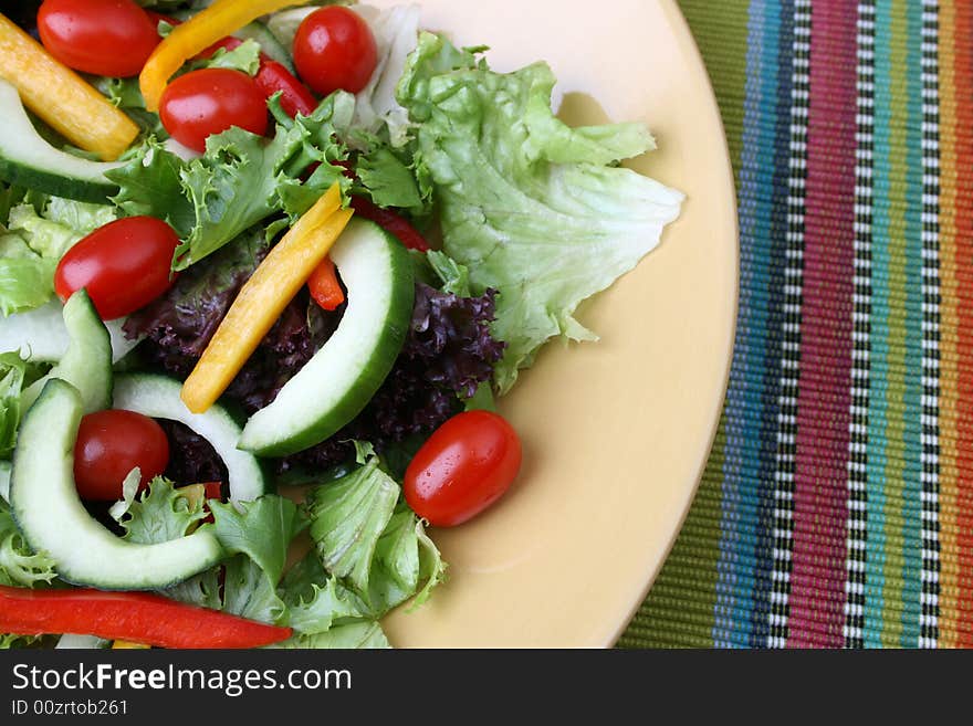 Fresh colorful salad with cherries tomatoes and cucumber