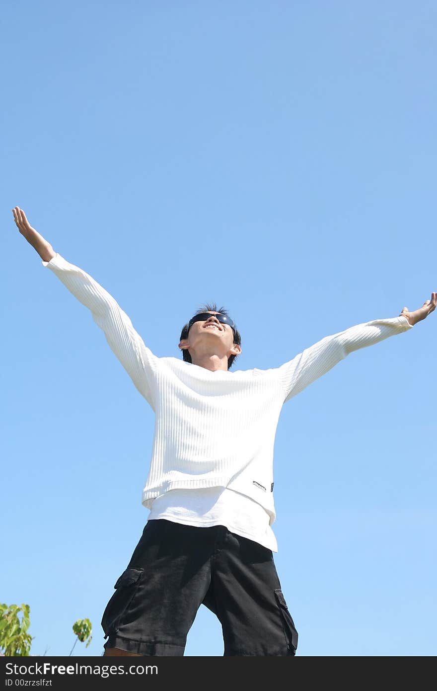 Man look up at hot day in tropical weather