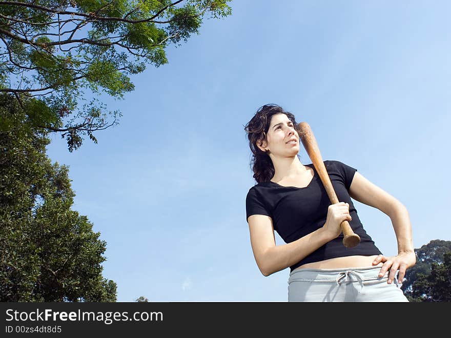 Woman With Baseball Bat in Park - Horizontal