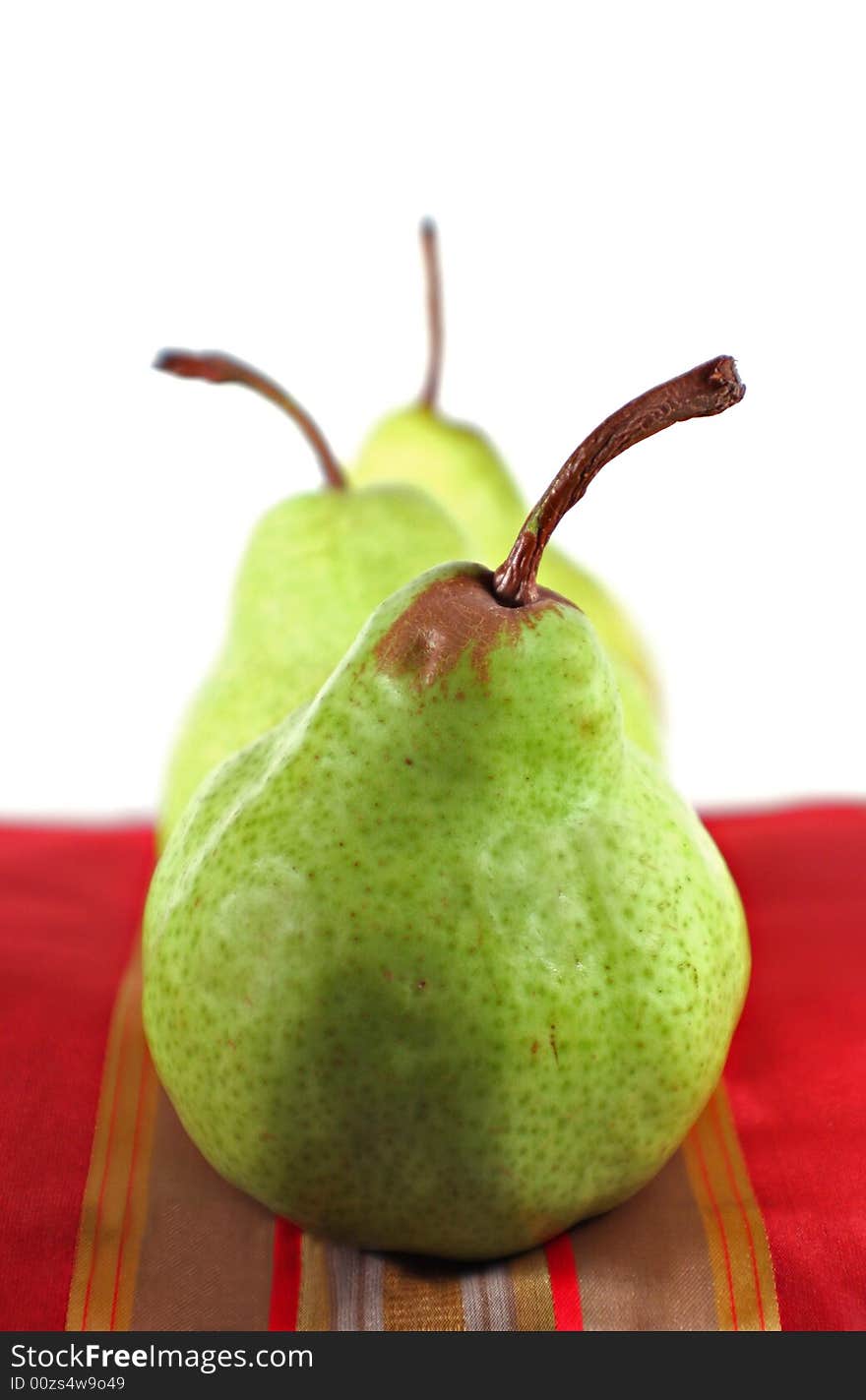 Pears set up with various backgrounds on various fabrics