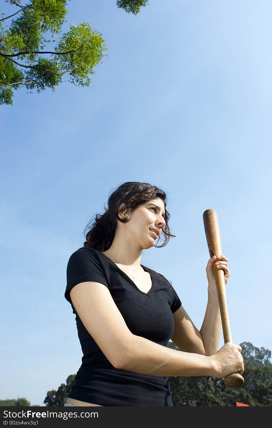 Woman Holding A Baseball Bat At Park - Vertically