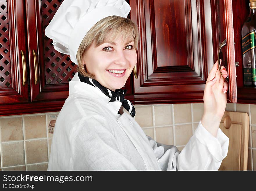 Cook woman cooking on the kitchen