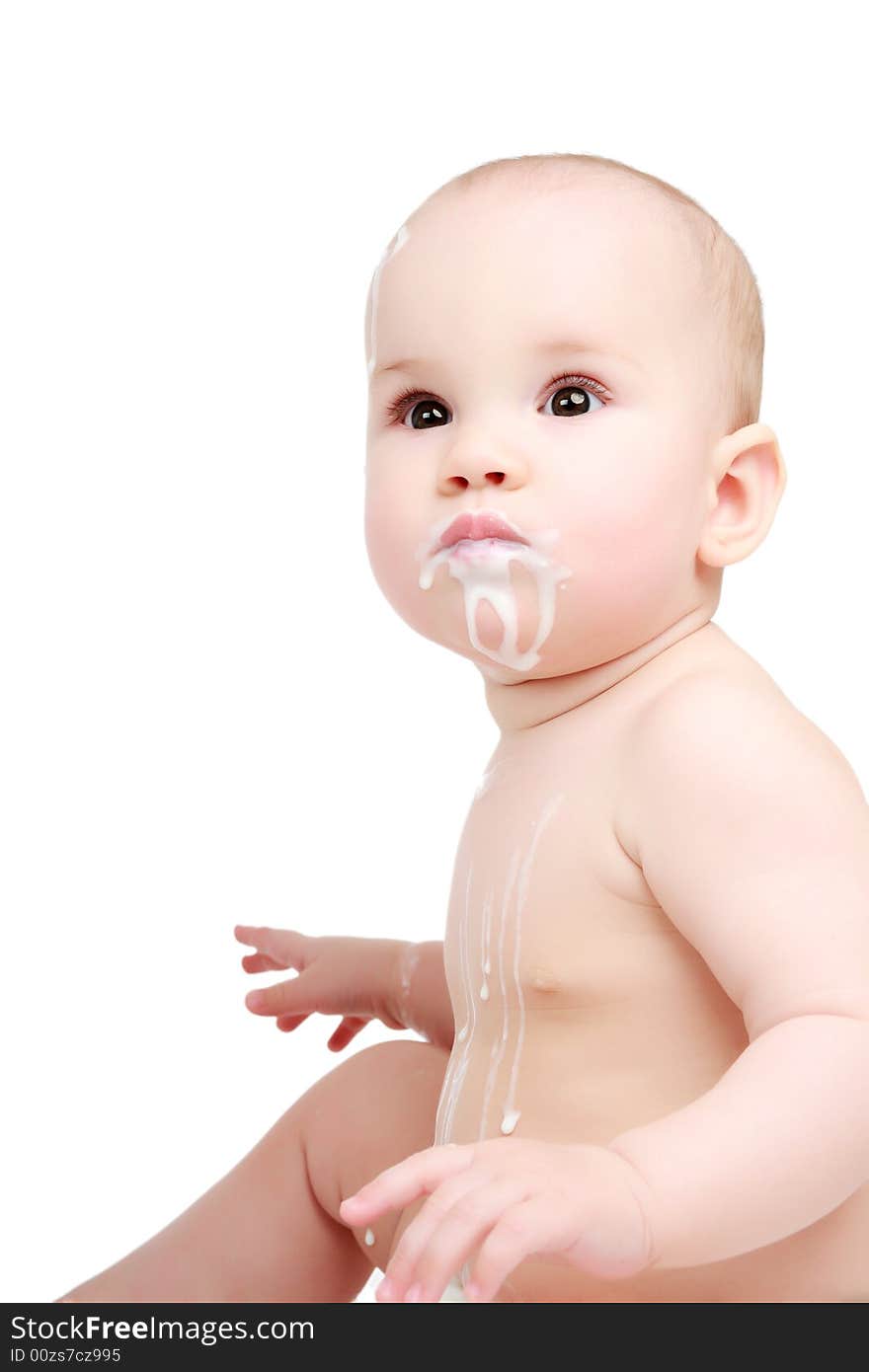 Feeding. Beautiful baby. Shot in studio. Isolated on white. Feeding. Beautiful baby. Shot in studio. Isolated on white.