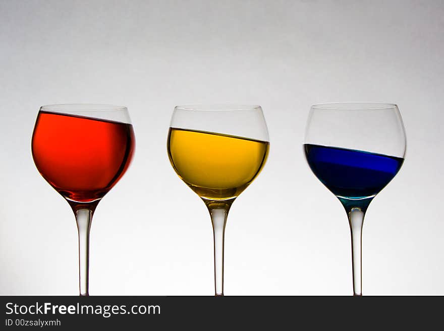 Wineglasses With Colored Liquid At Odd Angle