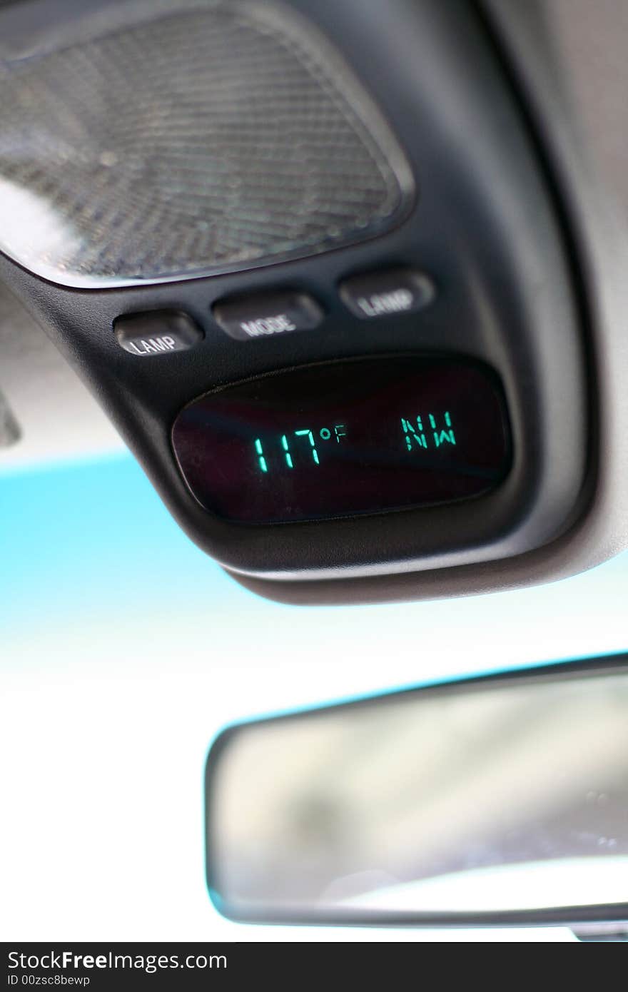 Car temperature gauge showing 117 degrees fahrenheit...a very hot day!  Vertical view. Car temperature gauge showing 117 degrees fahrenheit...a very hot day!  Vertical view.