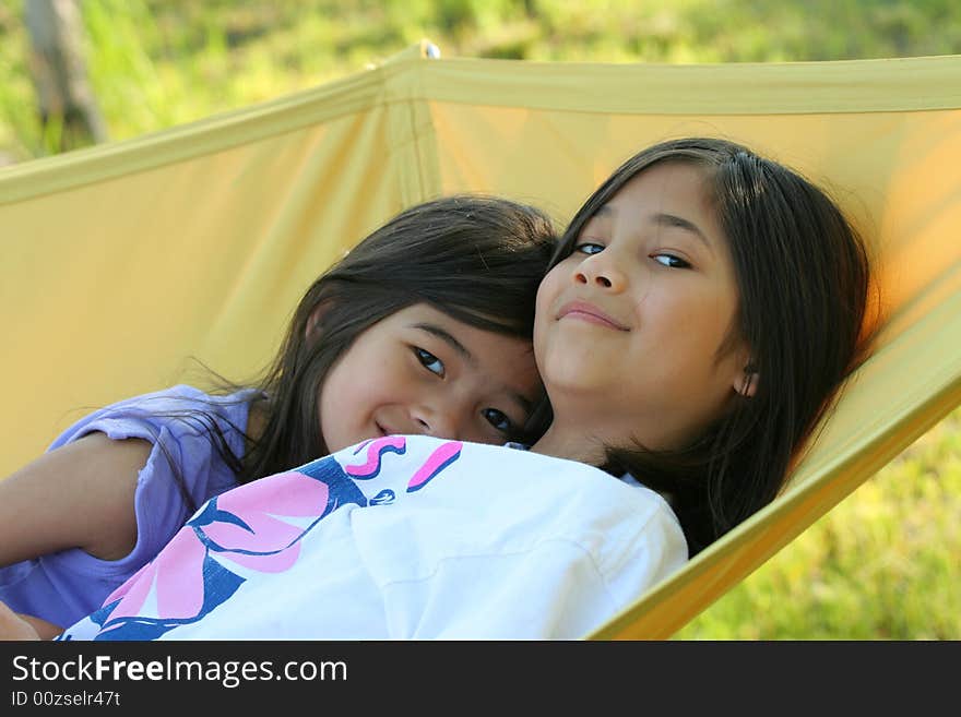 Two girls on a hammock