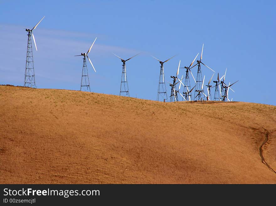 Several wind-driven generators atop a hill in California, USA