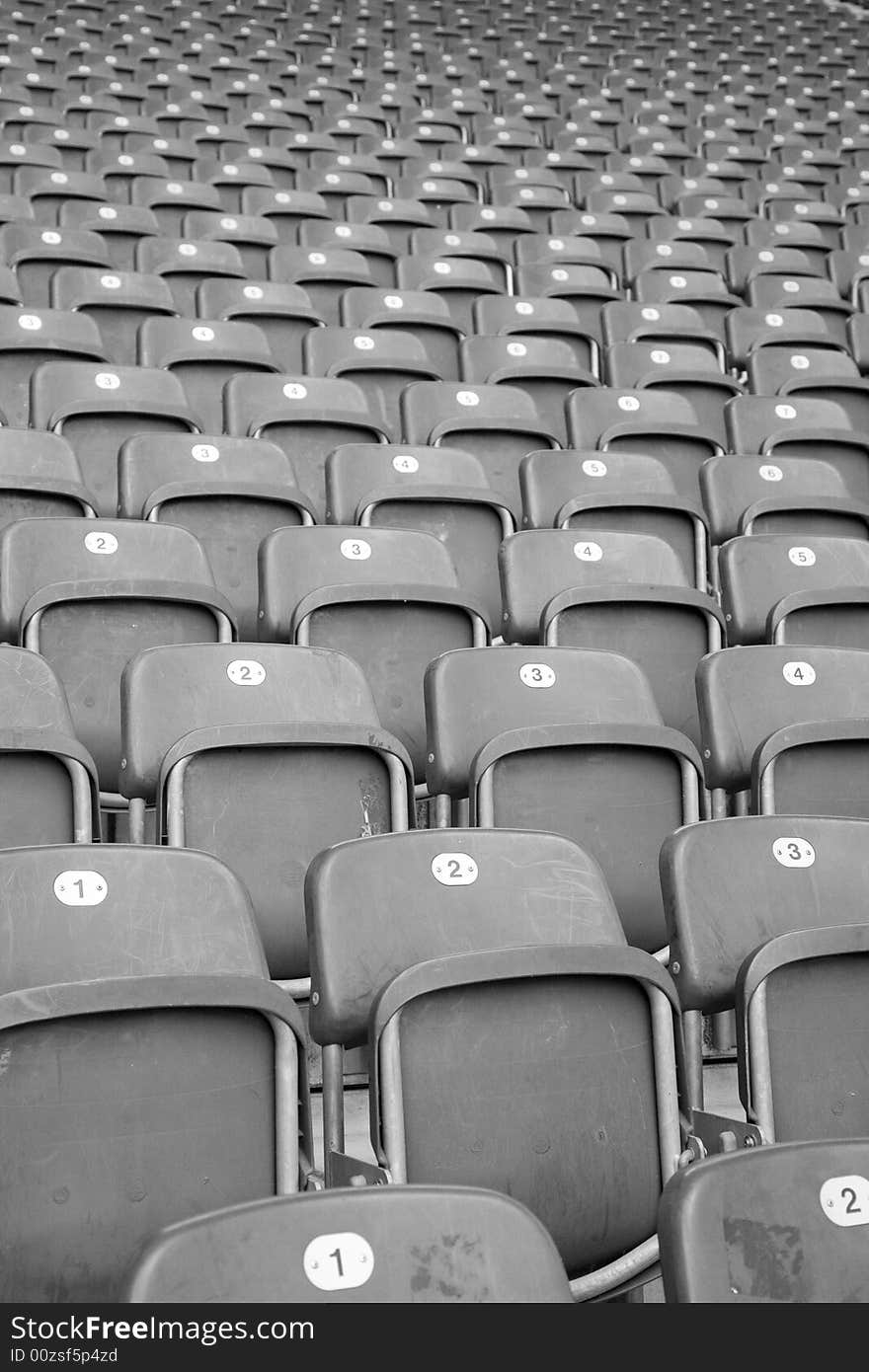 Rows and rows of empty seats in a football stadium