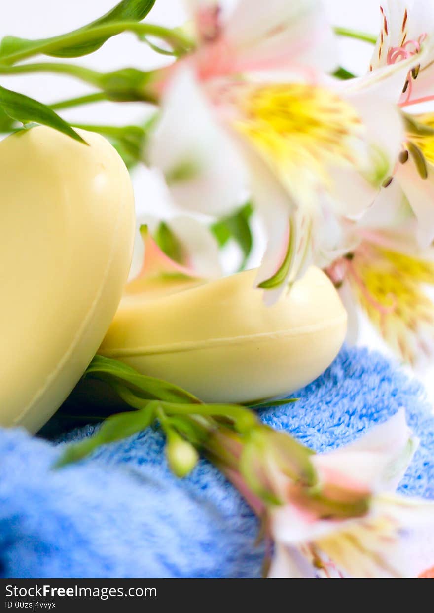 Soap and flower on blue fabric