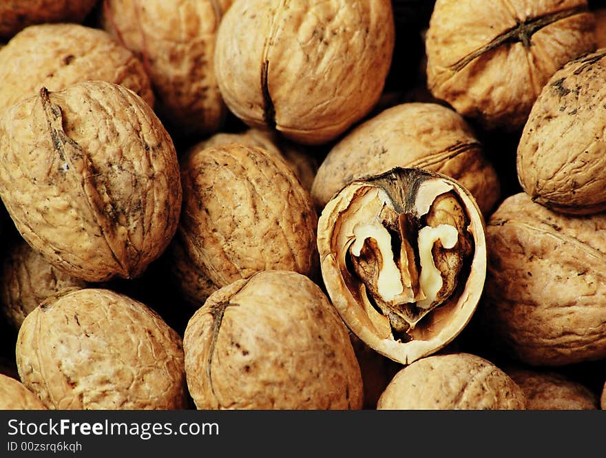 Bowl full of brown nuts. Bowl full of brown nuts