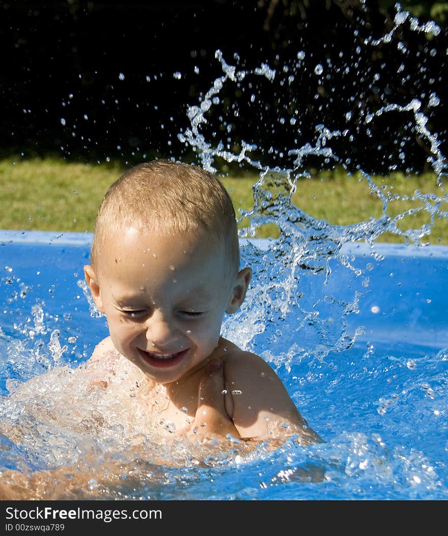 Small boy in swimming pool