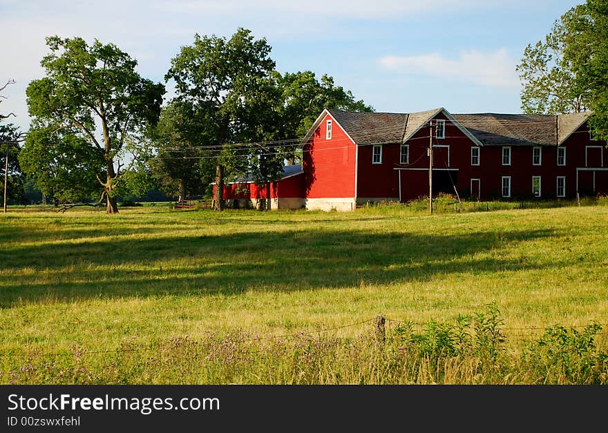 This is a photo of a barn and some of the property around it. This is a photo of a barn and some of the property around it.