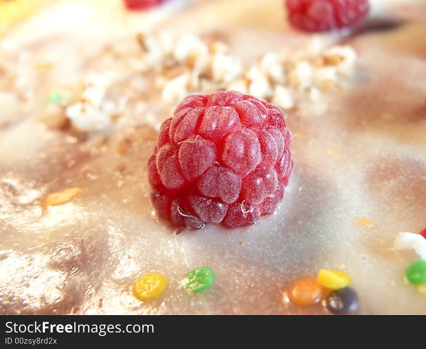 Red berry of raspberry on a pie