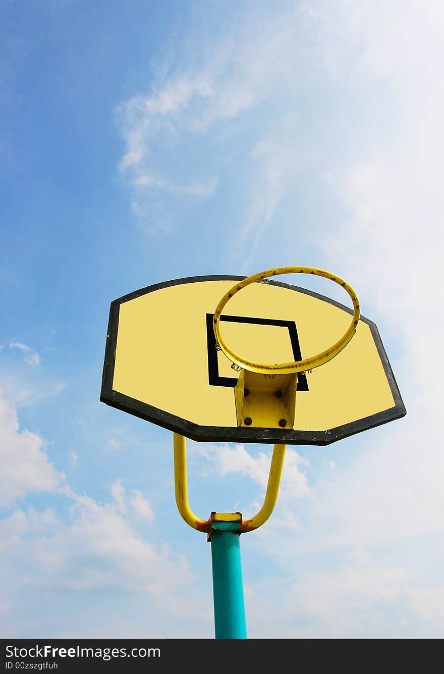 The backboard with a blue sky background .