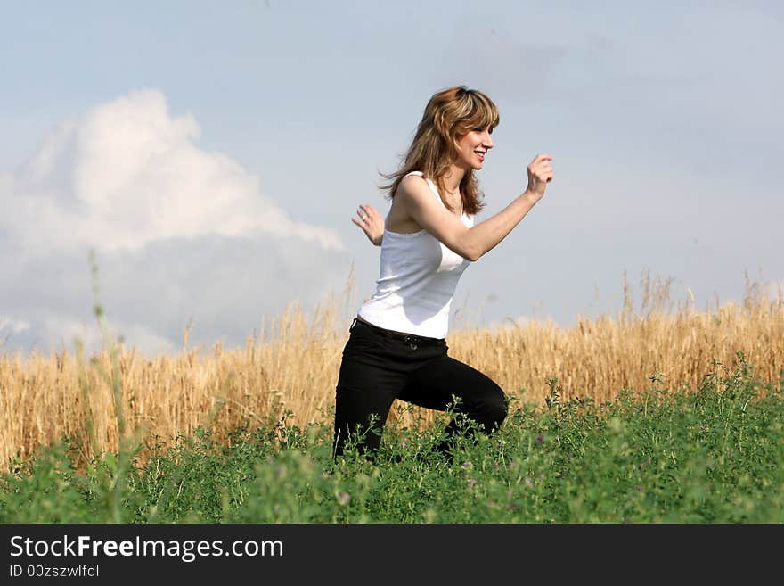 A beautiful girl running on the field