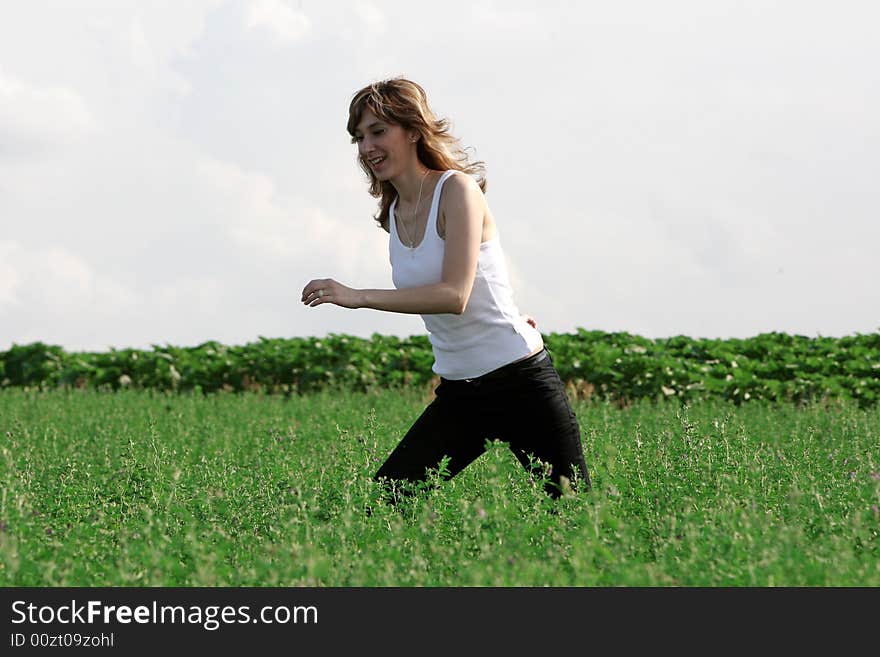 A beautiful girl running on the field