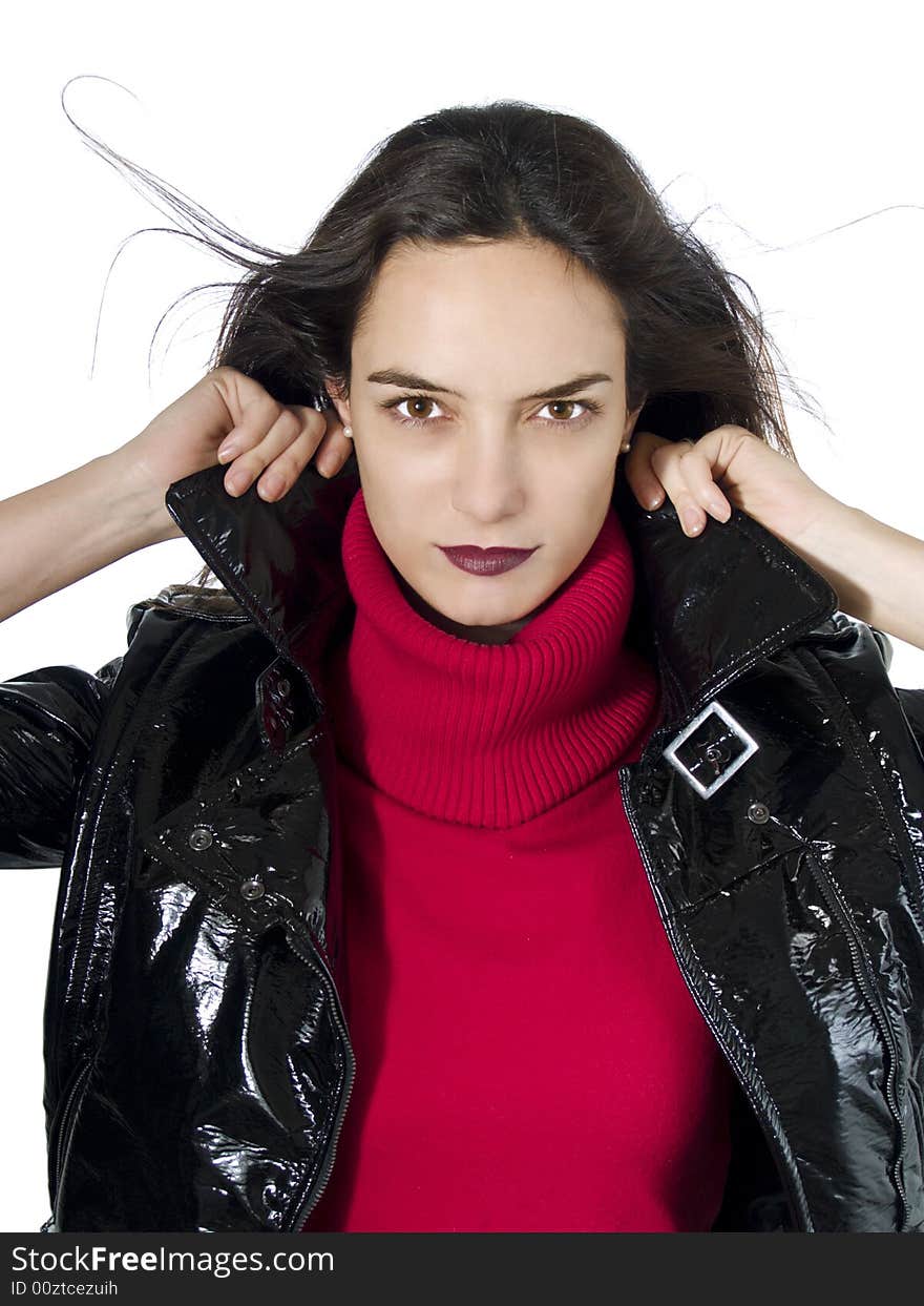 Portrait of a beautiful model holding her black leather jacket over white background. Portrait of a beautiful model holding her black leather jacket over white background.