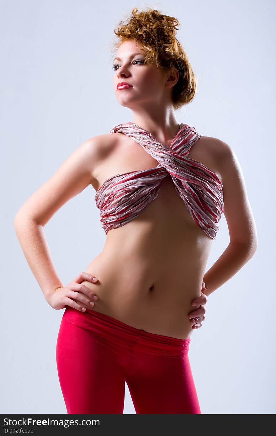 Attractive young model with curly red hair over white