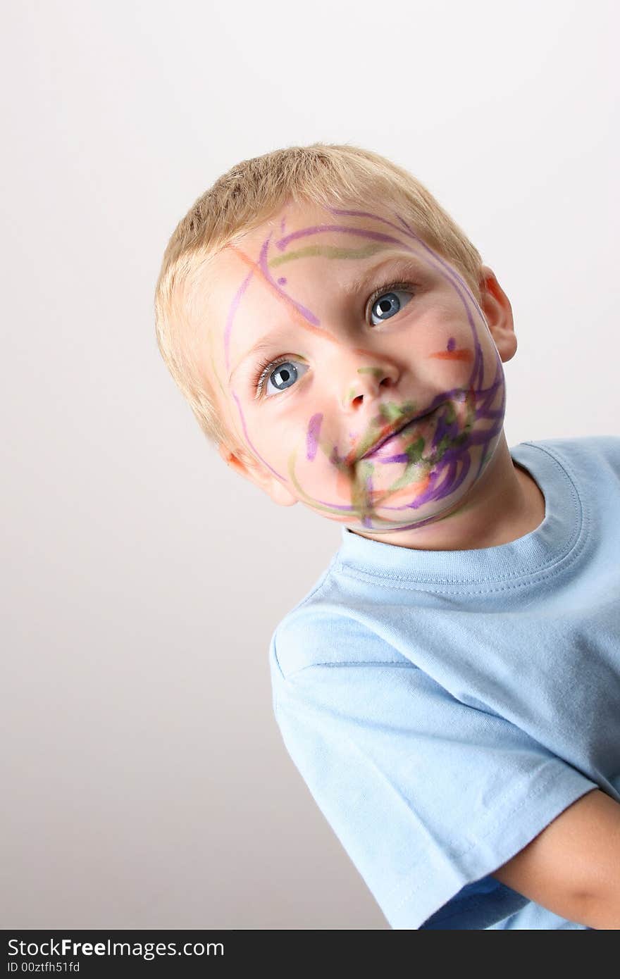 Laughing Toddler playing with colored pens making a mess. Laughing Toddler playing with colored pens making a mess