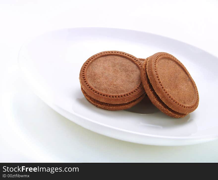 Crispy biscuits on a white plate. Crispy biscuits on a white plate