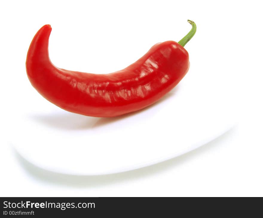 Fresh red chili pepper on white plate and isolated on white background