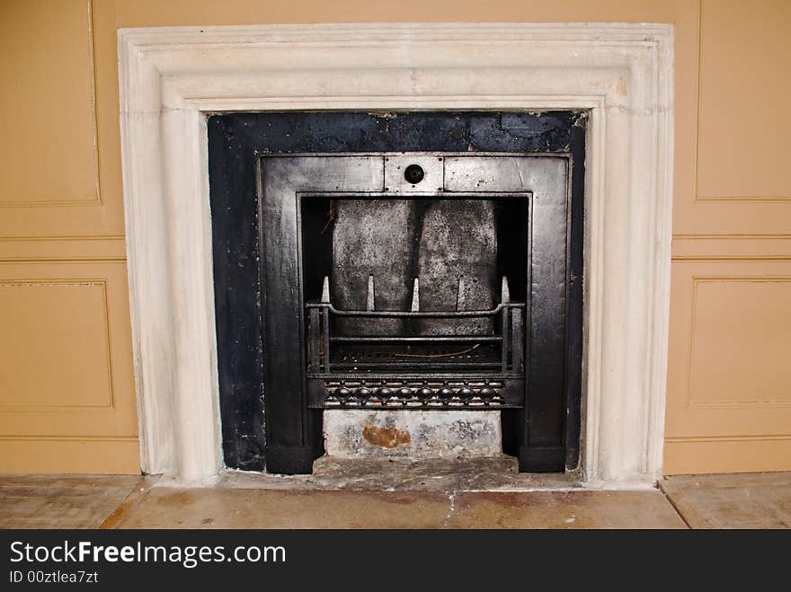 An authentic and historic fireplace in the staff wing of an Elizabethan mansion. An authentic and historic fireplace in the staff wing of an Elizabethan mansion