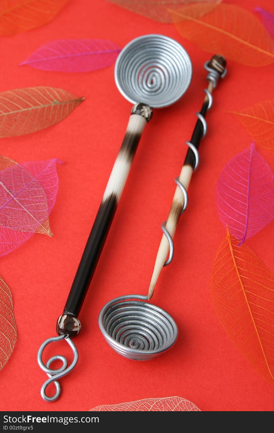 Hand Made Quill spoons on a red background