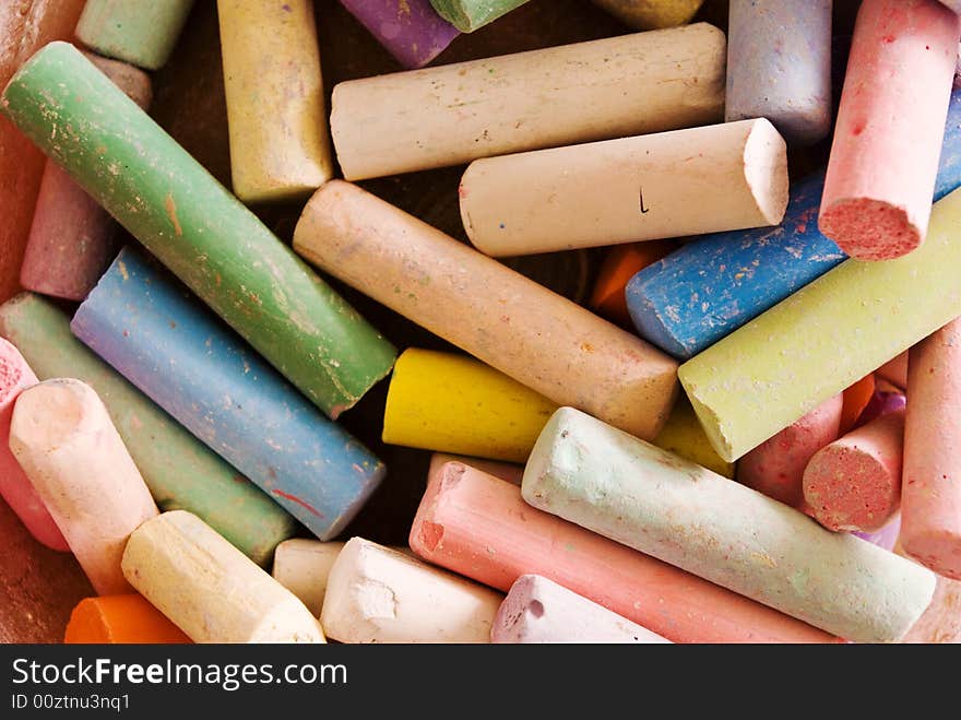 A close up shot of a box of chalks. A close up shot of a box of chalks